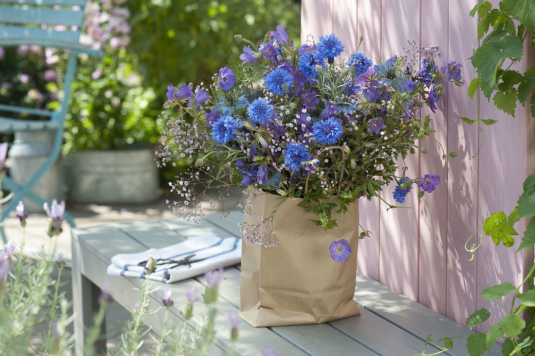 Bouquet of summer flowers in paper bag (2/2)