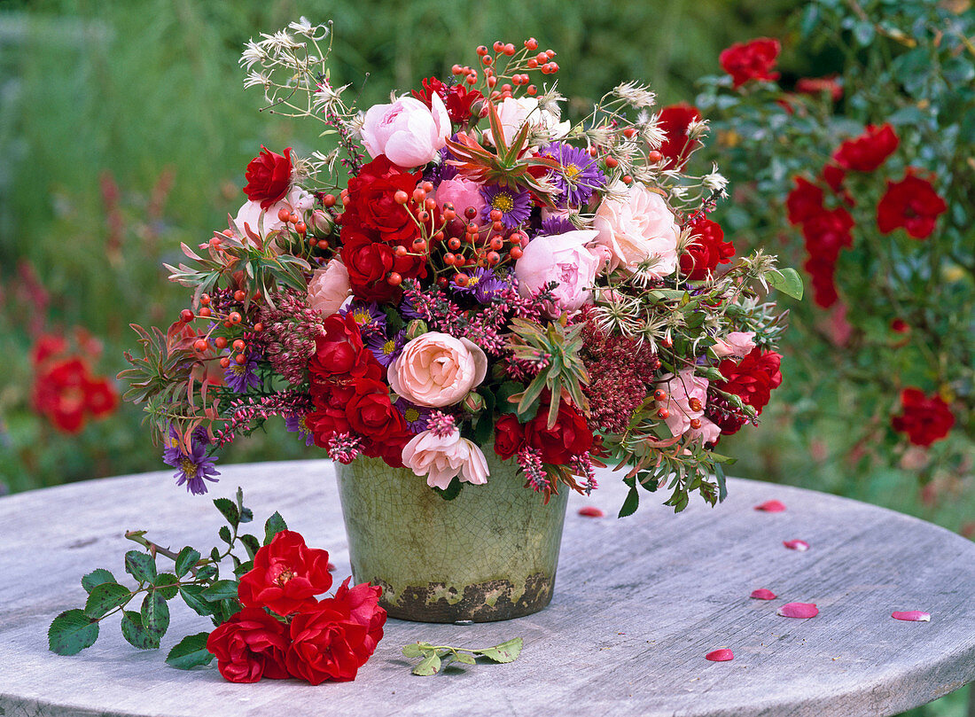 Late summer bouquet with Rosa (roses, rose hips), Sedum (stonecrop)