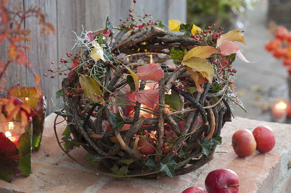 Autumnal ball object made of dry branches decorated as a lantern