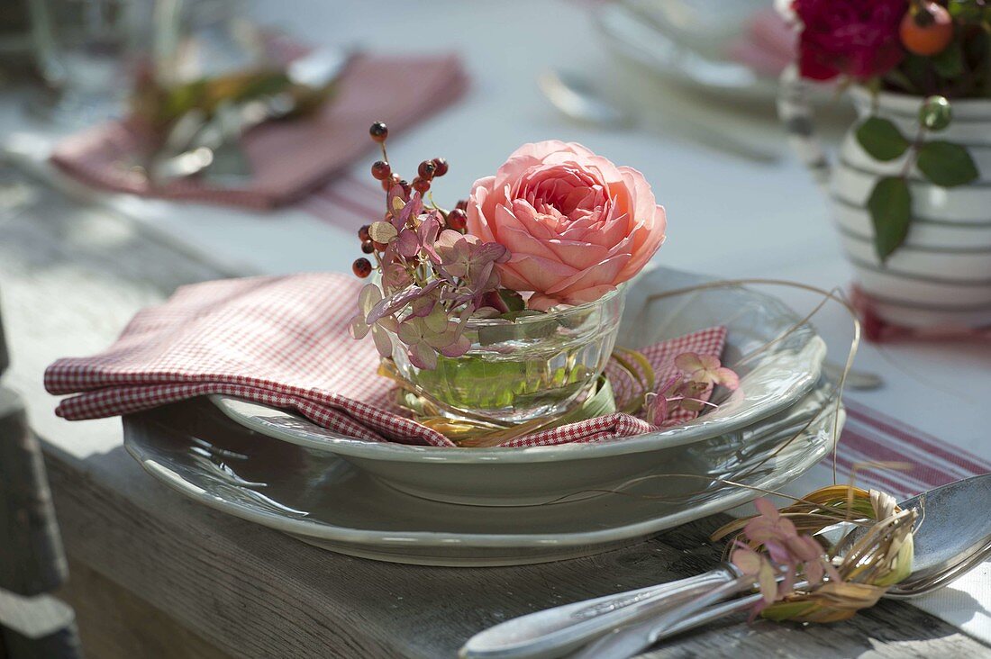 Autumnal rose table decoration on the terrace