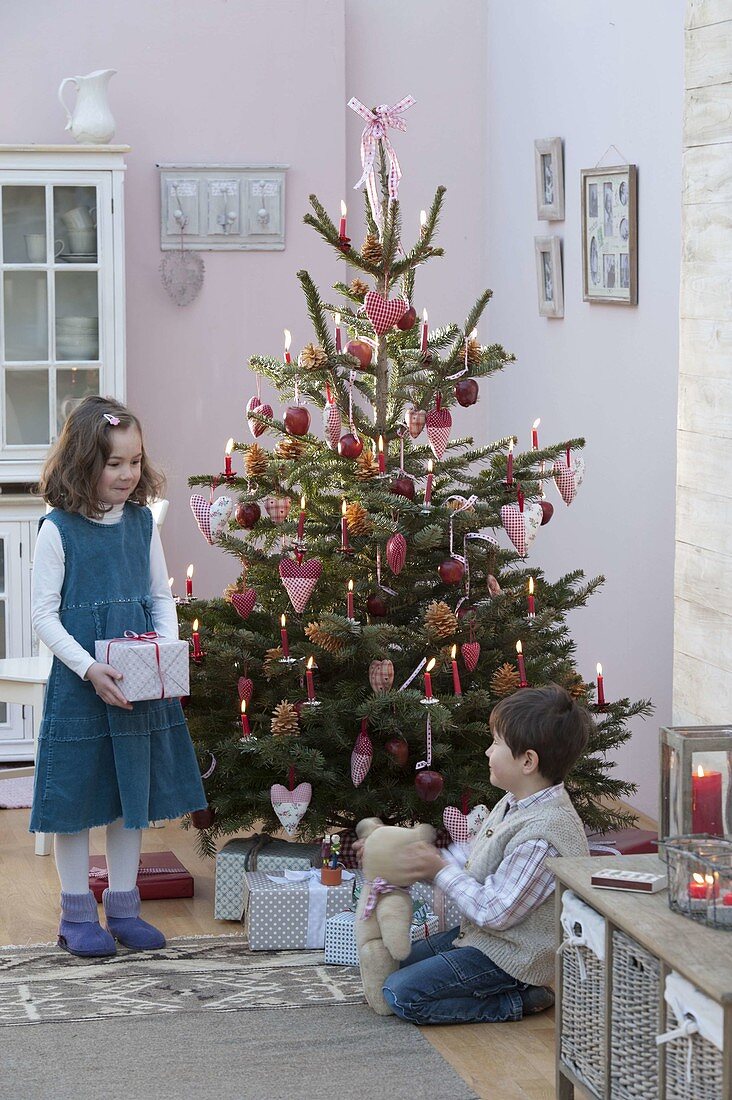 Christmas tree with hearts, cones and apples