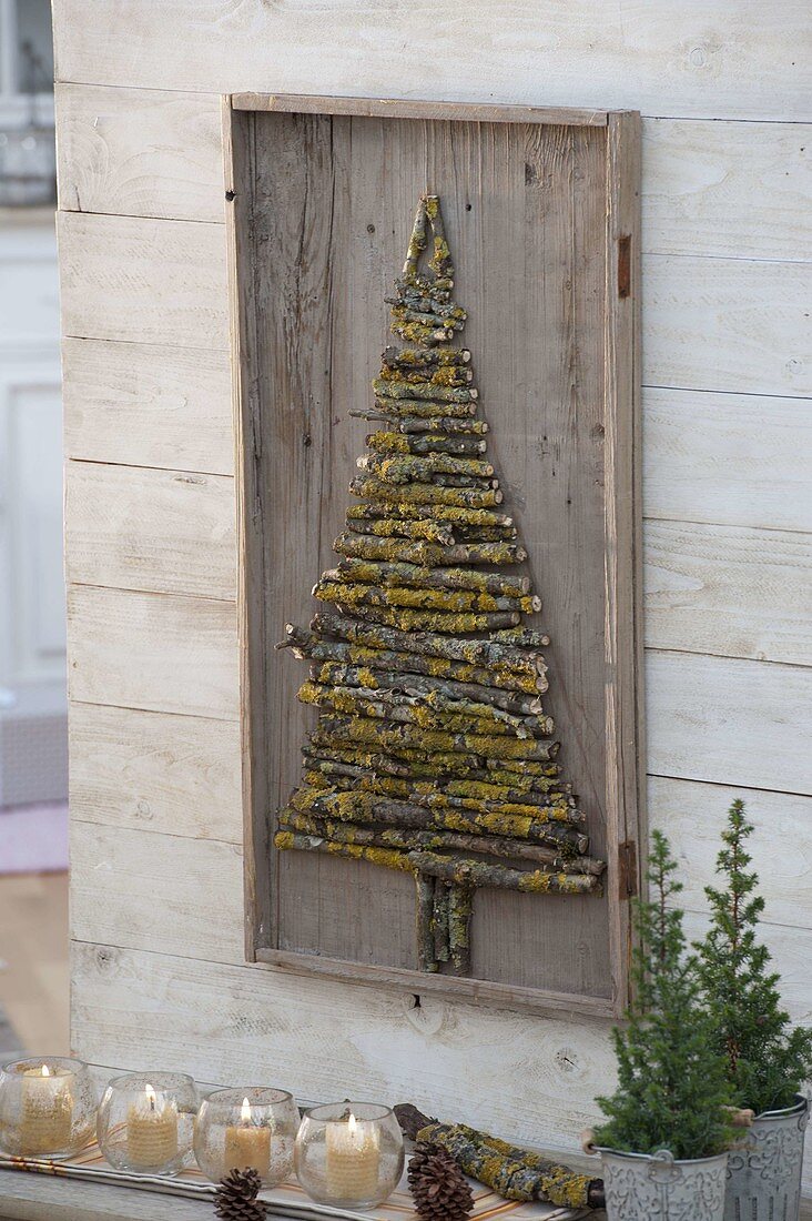 Homemade mural made of lichen-covered branches