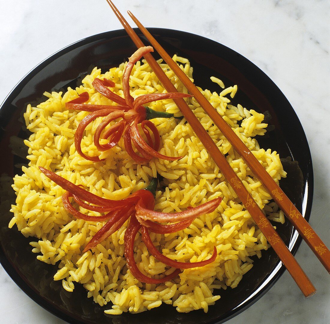 Curried rice garnished with chili flowers