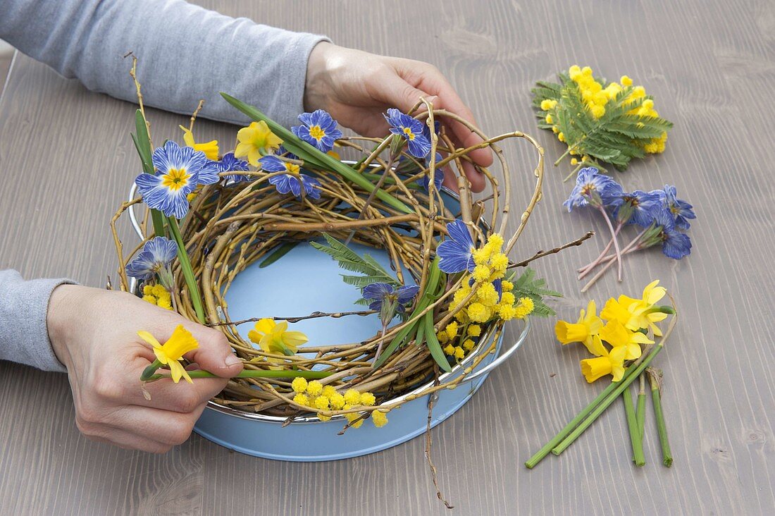 Willow wreath with primroses and daffodils