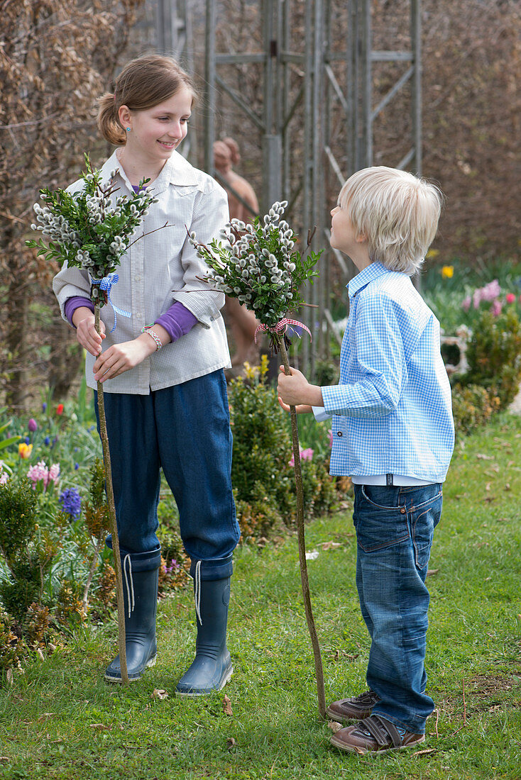 Children with tied palm bouquets made from branches of Salix (catkin willow)