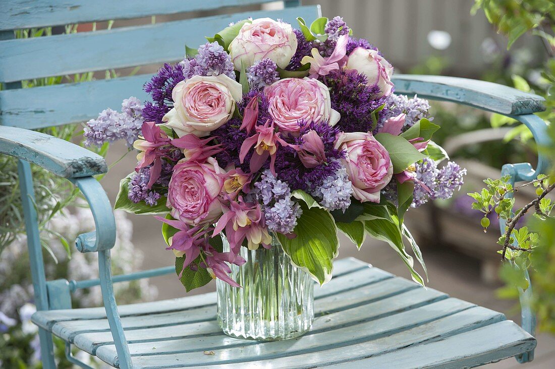 Fragrant spring bouquet of Rosa (roses), Syringa (lilac), Allium