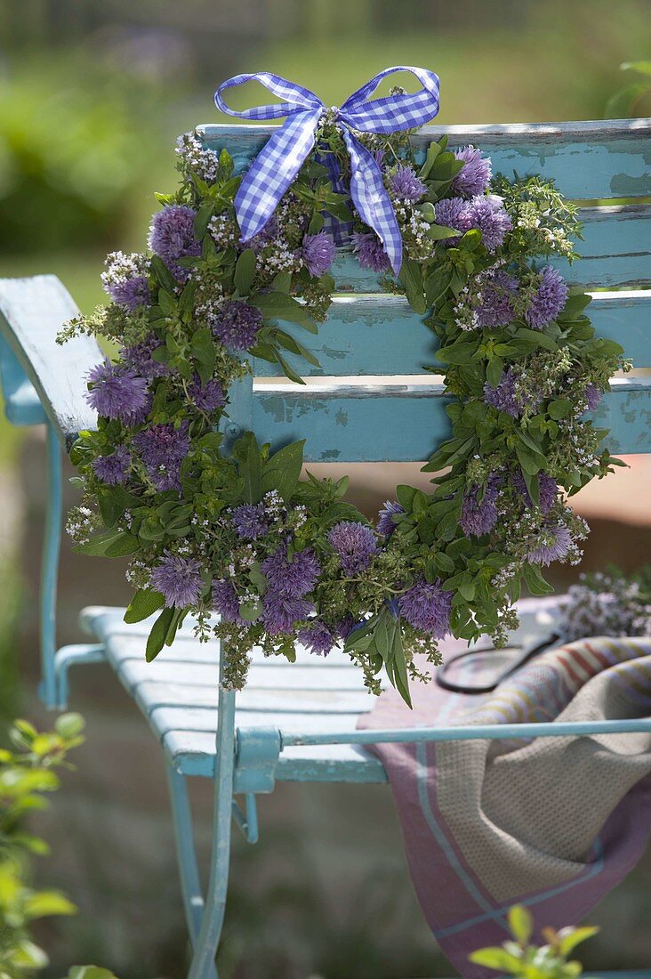 Herb wreath with flowers of chives (Allium schoenoprasum), thyme