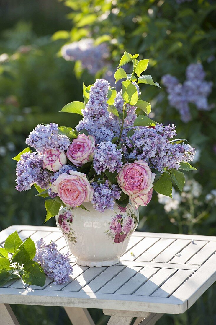 Romantic scented bouquet with Rosa (roses) and Syringa (lilac)
