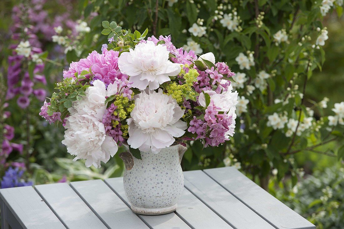 White-pink bouquet of Paeonia (Peonies), Weigelia (Vine lily)