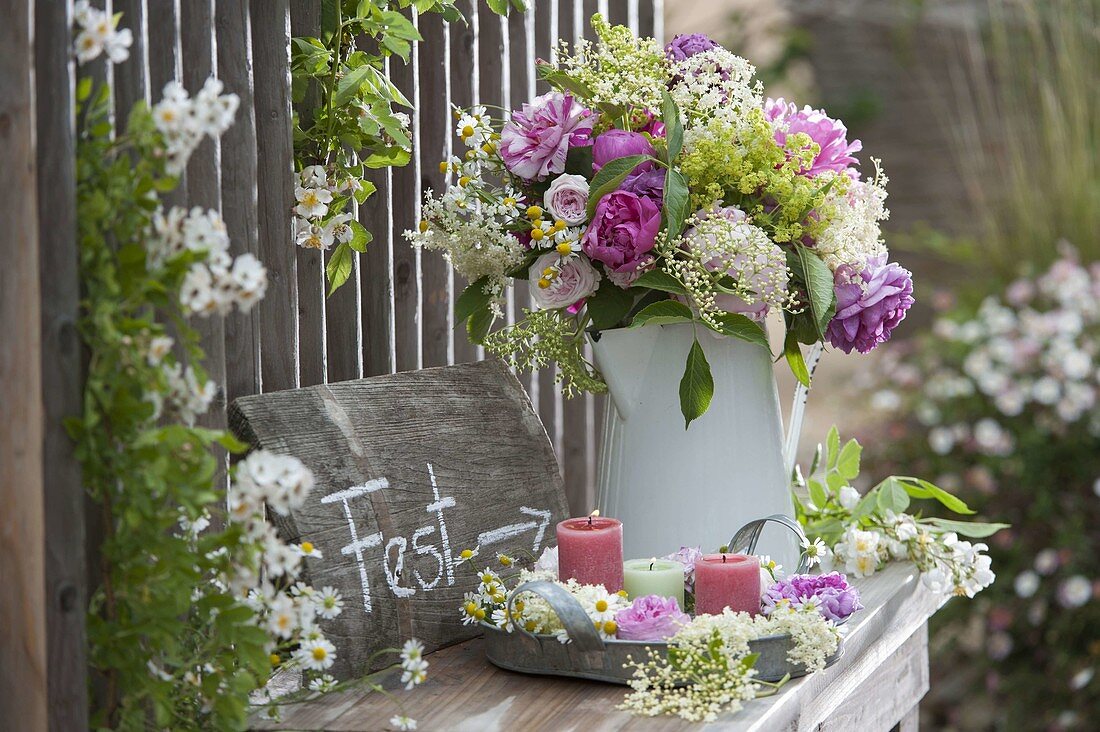 Early summer bouquet in white pot as a welcome gift