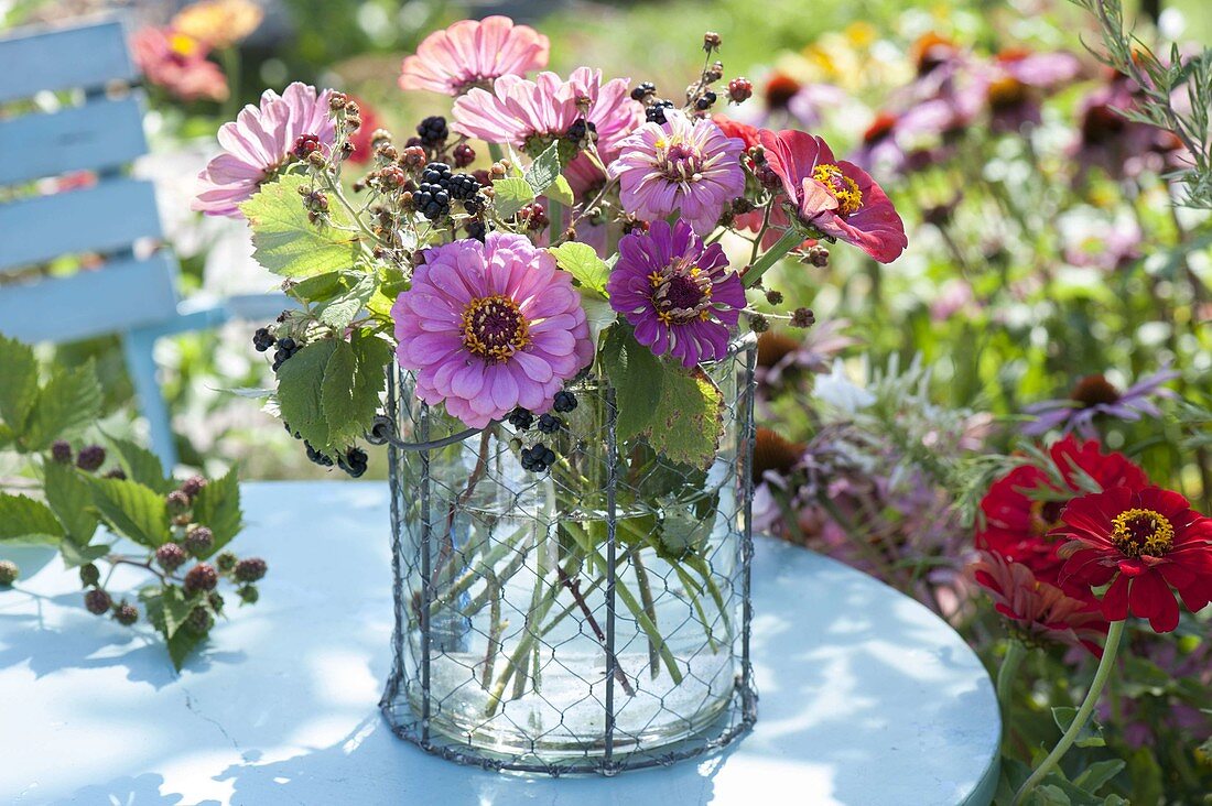 Summer bouquet with zinnia (zinnias) and blackberries (rubus)