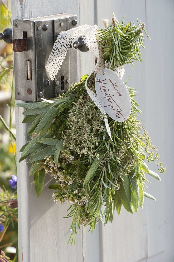 Herbal bouquet on the door handle