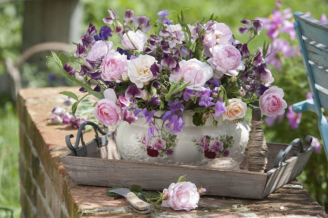 Romantic arrangement of Rosa (roses) and Lathyrus odoratus