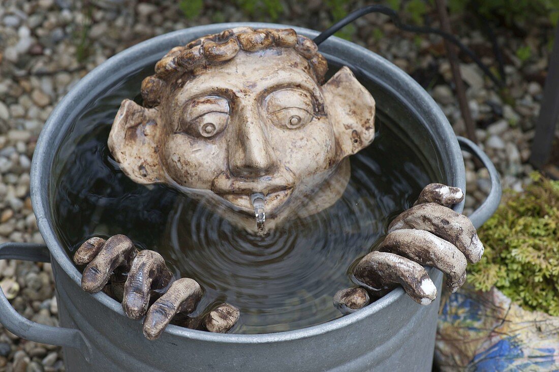 Pottery water feature Man in water