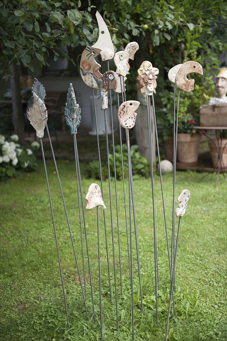 Pottery garden sticks on iron rods