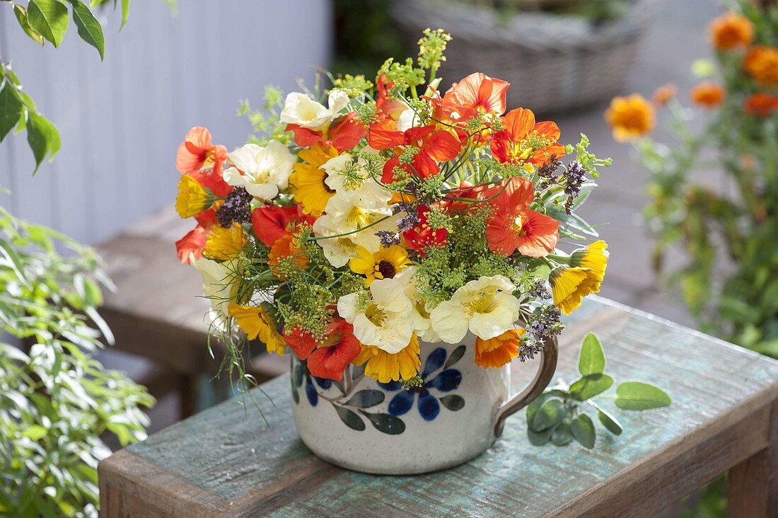 Bouquet of edible flowers and herbs