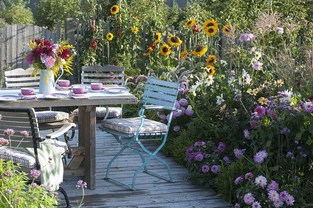 Summer flower bed on wooden deck