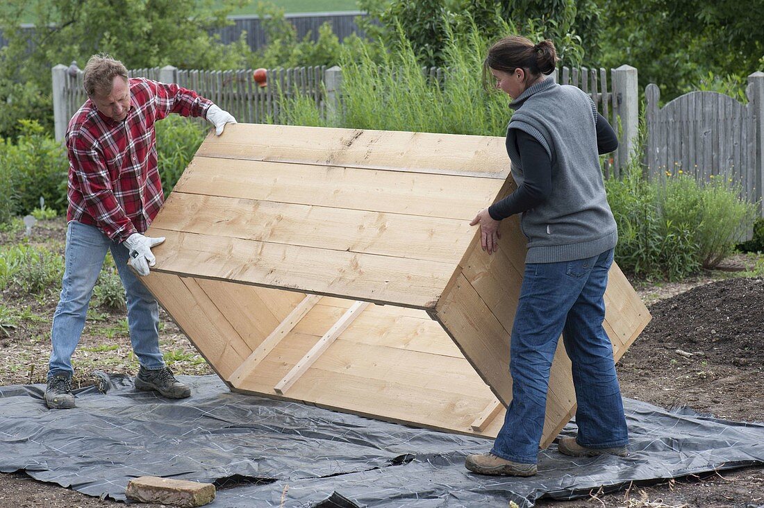 Build a raised flower bed of boards