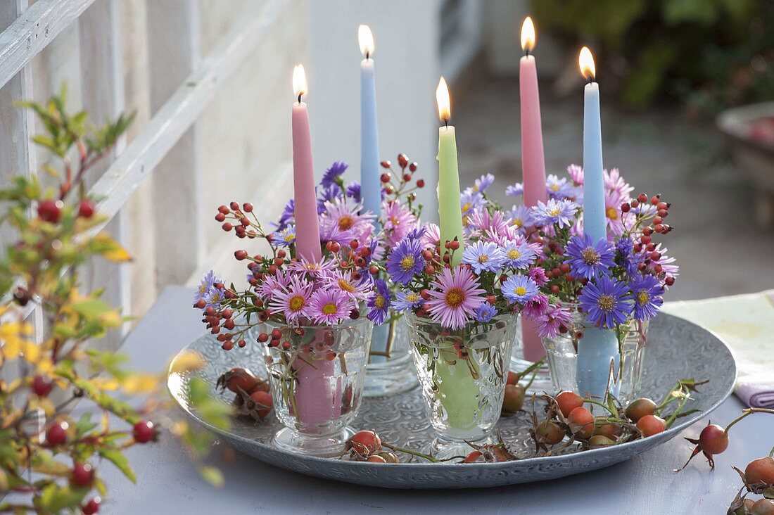 Candle jars with aster (autumn asters) and rose (rose hips)