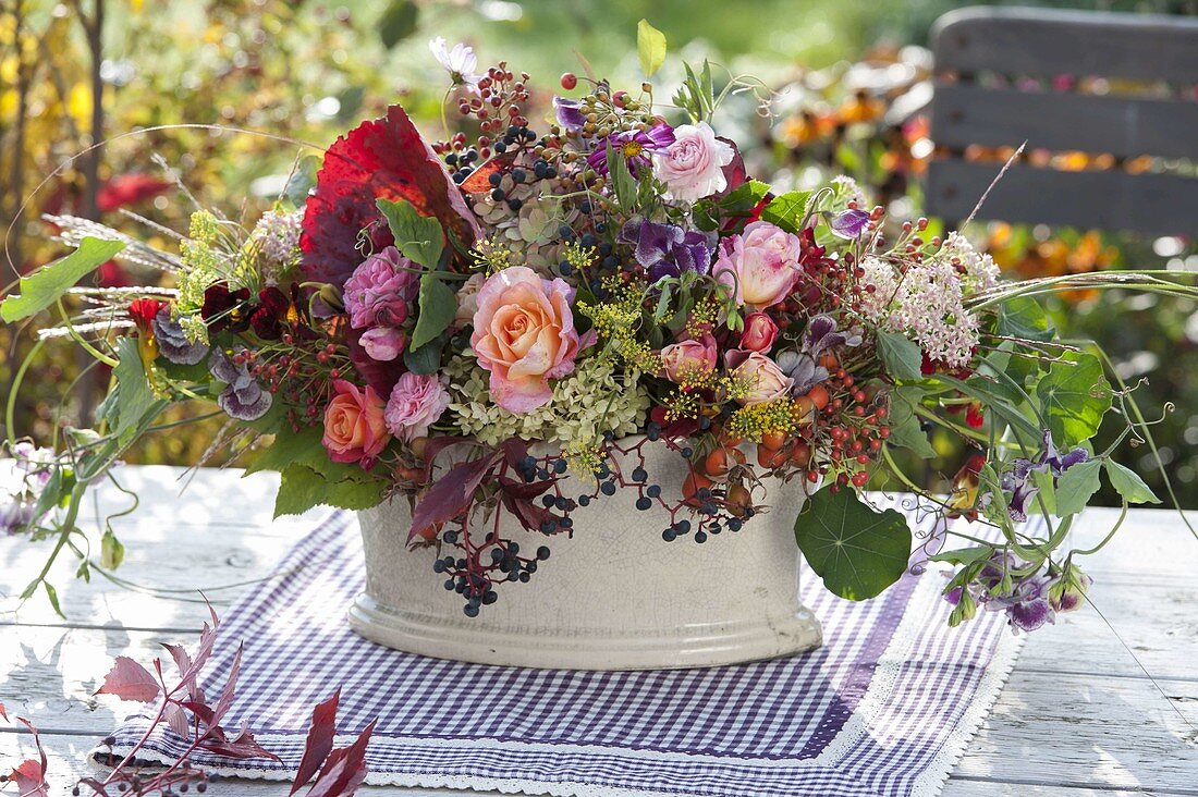 Autumn bouquet of pinks (roses, rose hips), hydrangea (hydrangea)