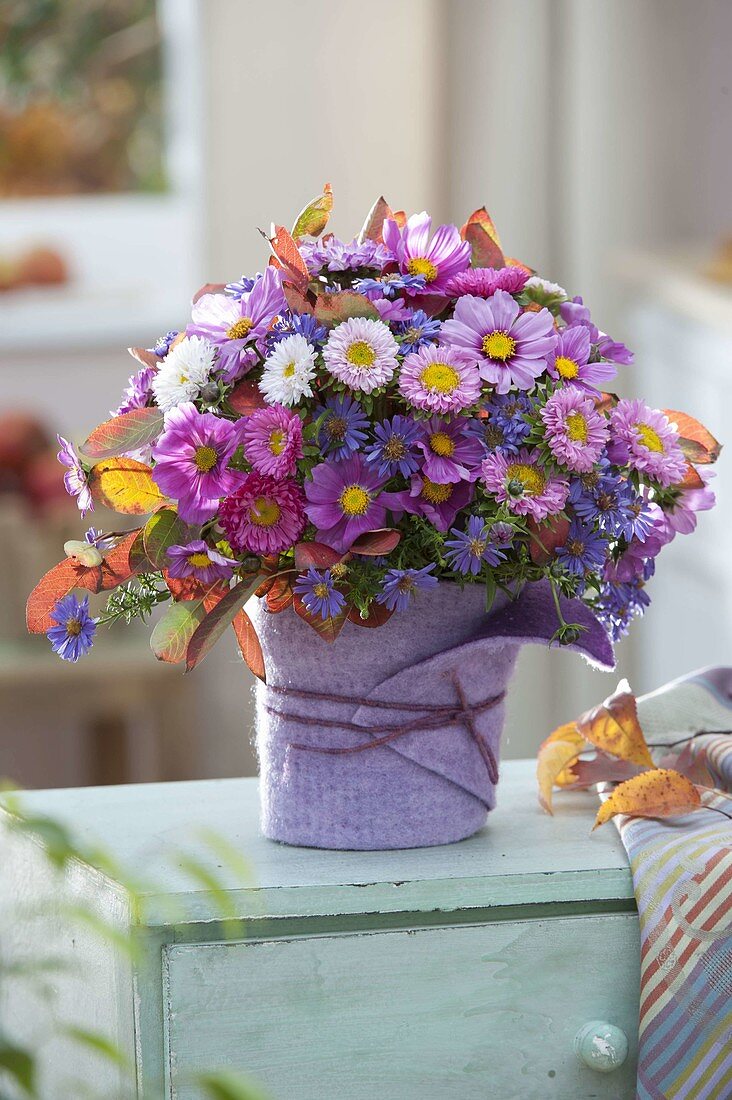 Autumn bouquet in vase with felt cover