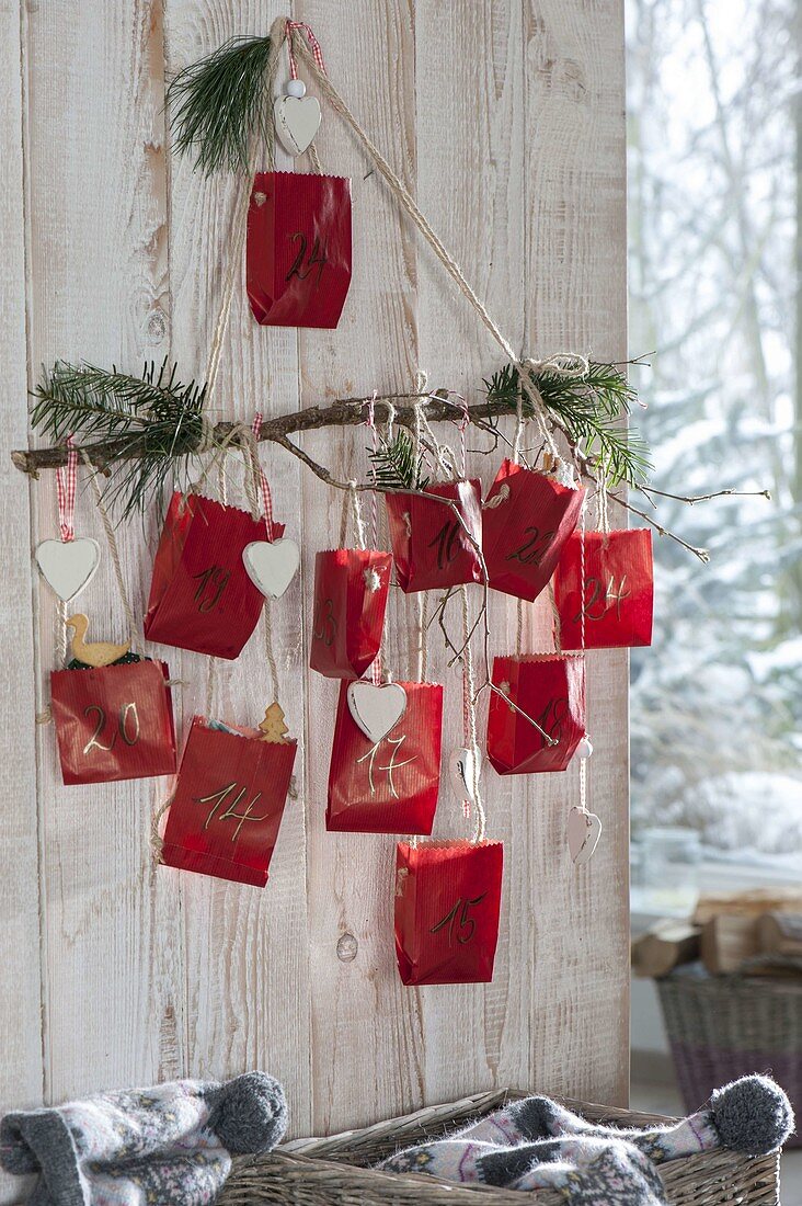 Homemade Advent calendar with numbered red paper bags