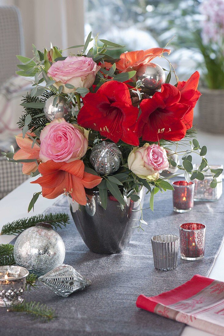 Christmas bouquet with Hippeastrum 'Orange Souvereign', 'Red Lion' (Amaryllis)