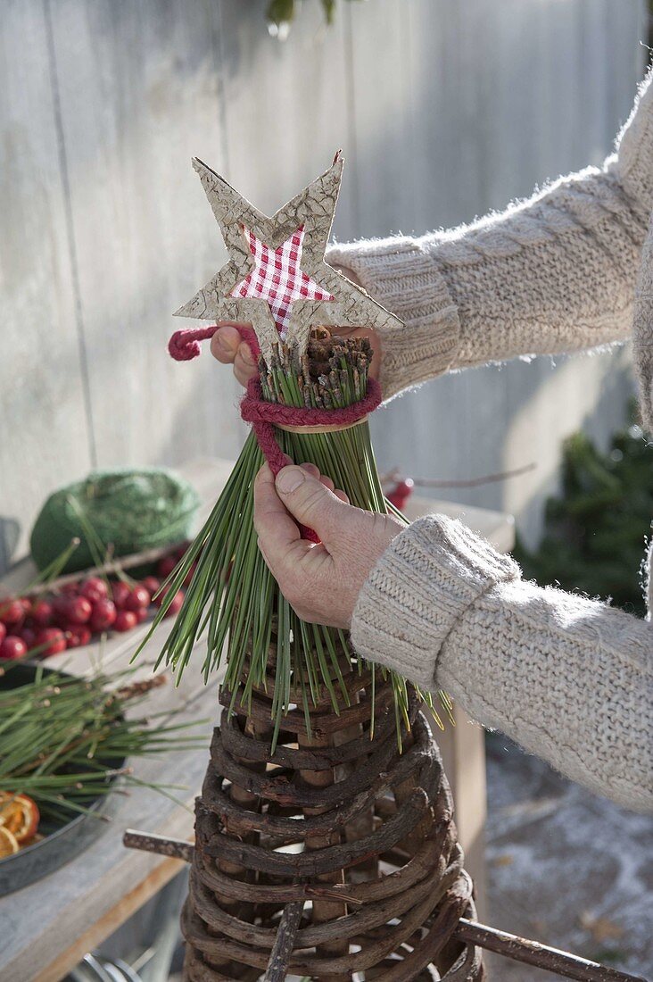 Cone made of grapevines to decorate a Christmas tree