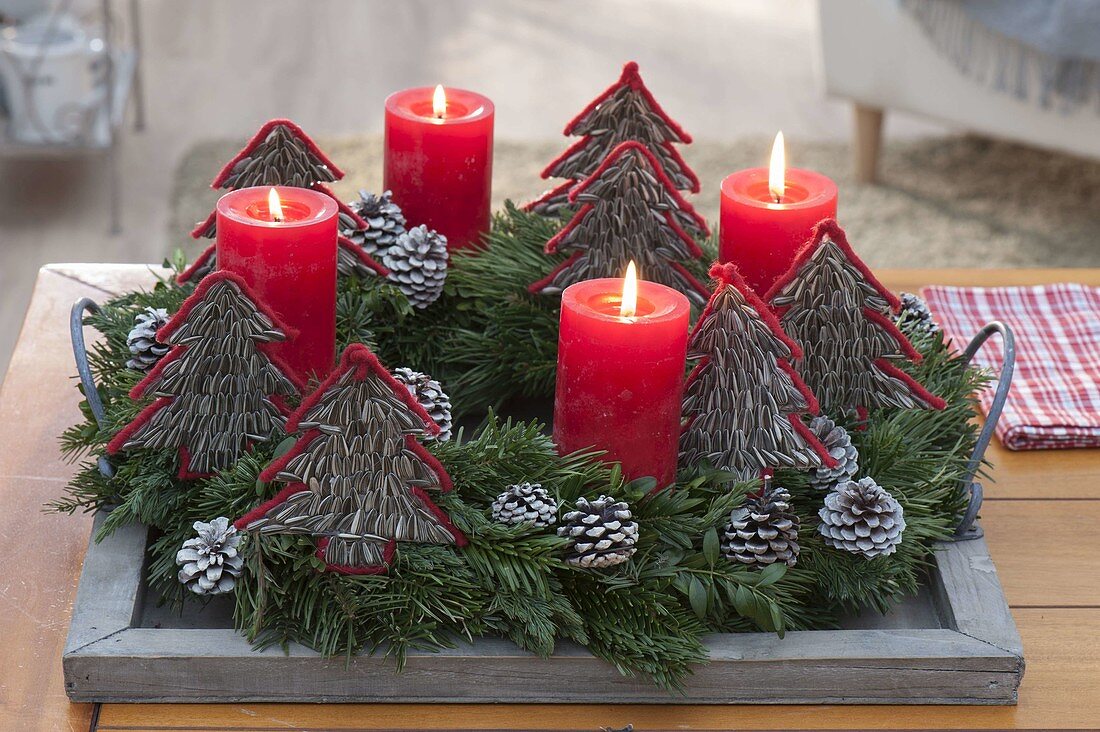 Advent wreath with homemade trees made of sunflower seeds