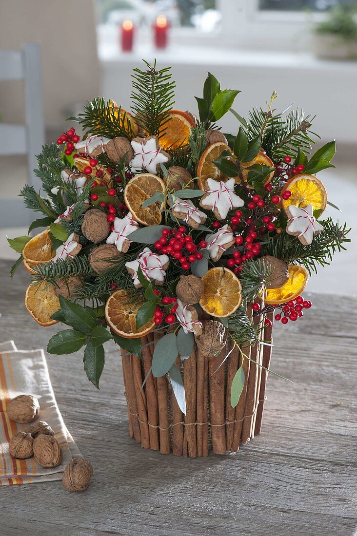 Dressing yoghurt buckets as planters with cinnamon sticks