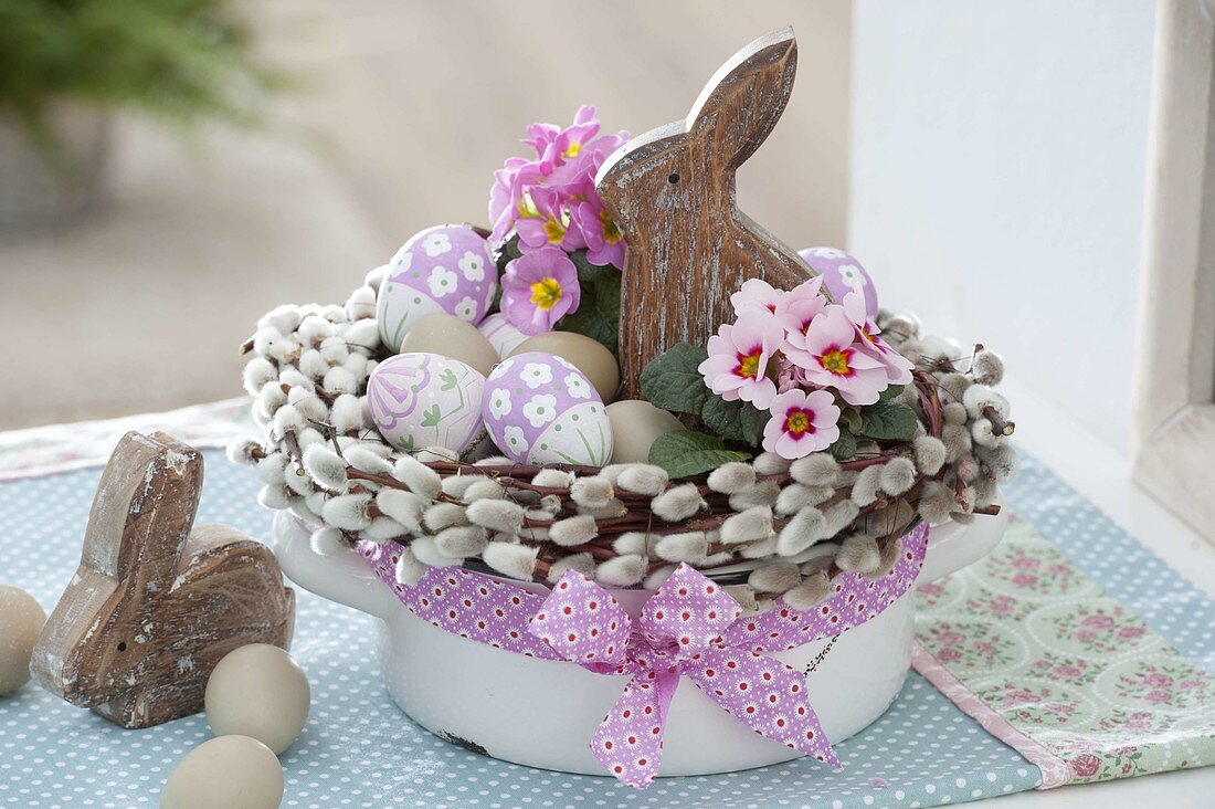 Easter nest in enamel pot with wreath made of salix (palm kitten)