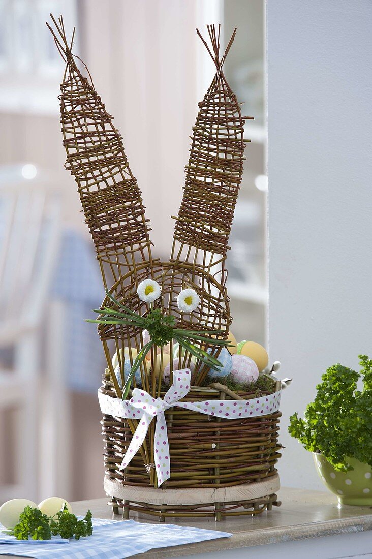 Homemade Easter basket with rabbit head as Easter nest, eyes made of bellis