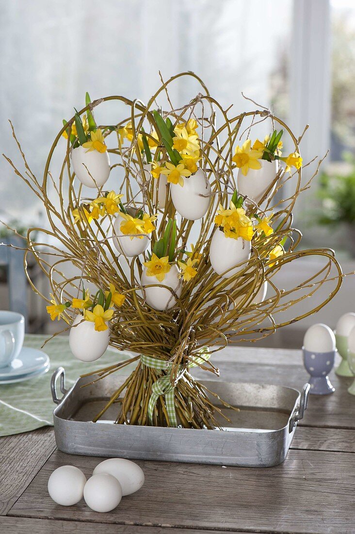 Willow with eggshells as vases standing bouquet