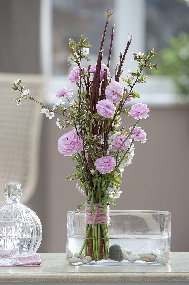 Stems bouquet with branches of Cornus, Prunus