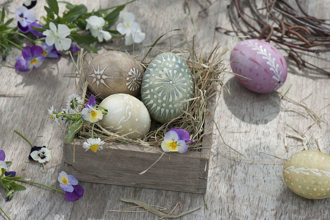 Egg coloring with wax reservation technique