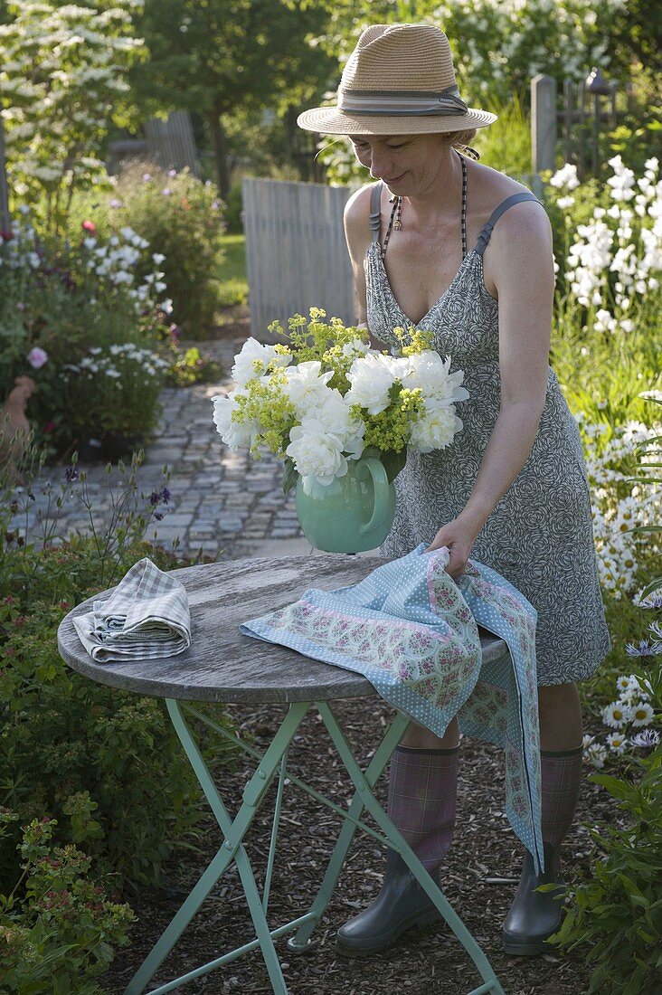 Small sitting area with bouquet of peonies