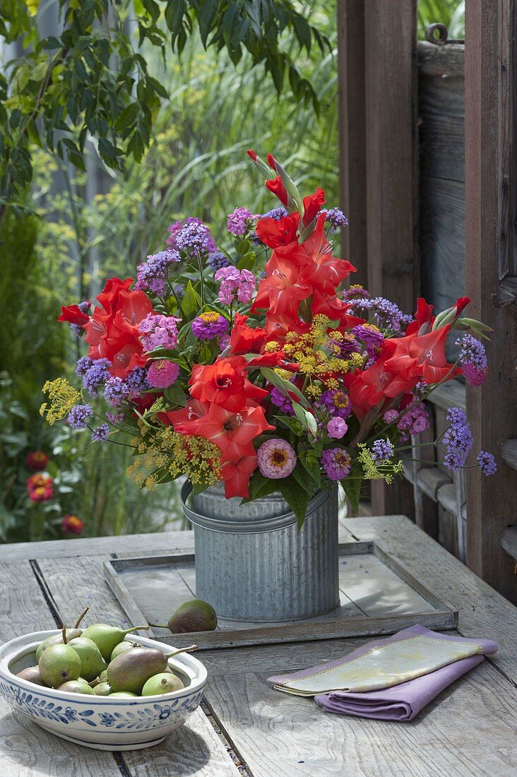 Late summer bouquet of Gladiolus (gladioli), Zinnia (zinnias), fennel