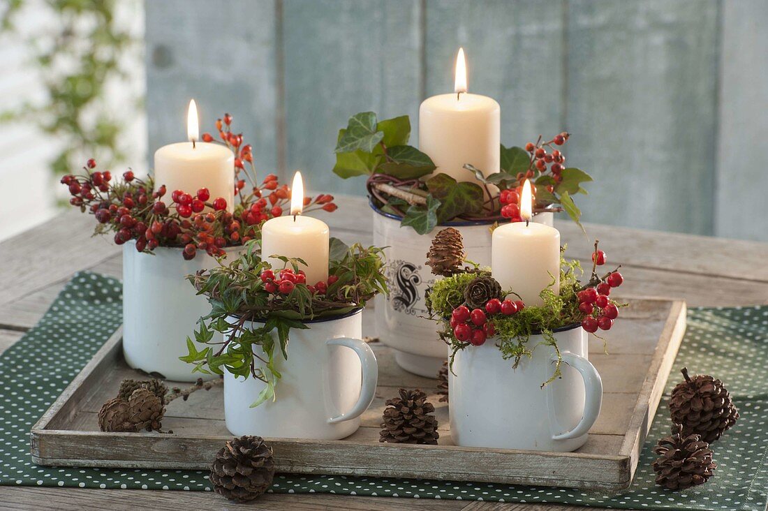 Unusual Advent wreath in enamel cups, decorated with holly