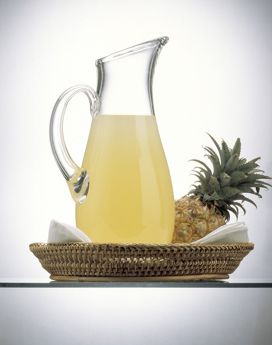 Pineapple Juice in a Decanter; Pineapple in a Basket