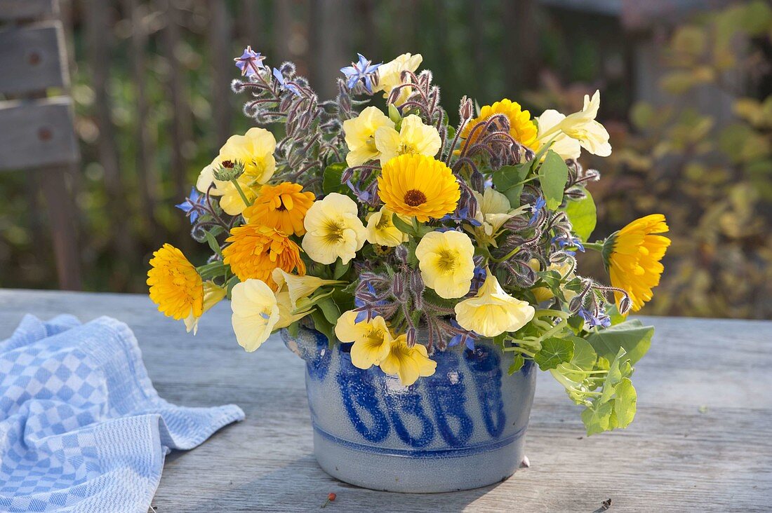 Bouquet of edible flowers: Calendula (marigolds), Tropaeolum