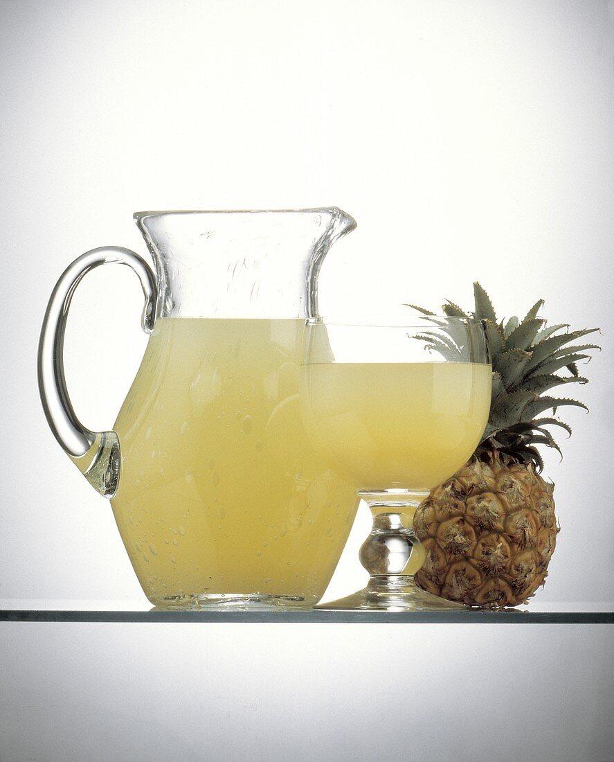 Pineapple Juice in a Pitcher and in a Glass