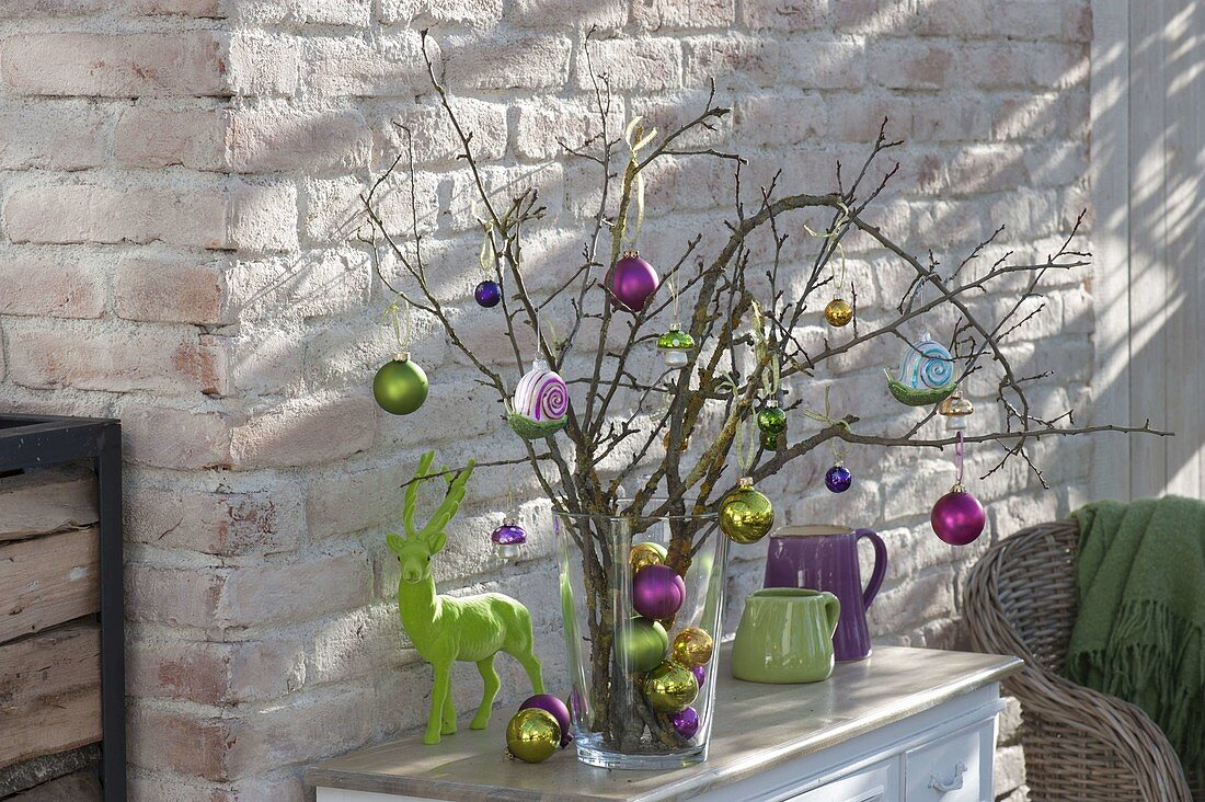 Christmas bouquet made of dry branches with tree decorations