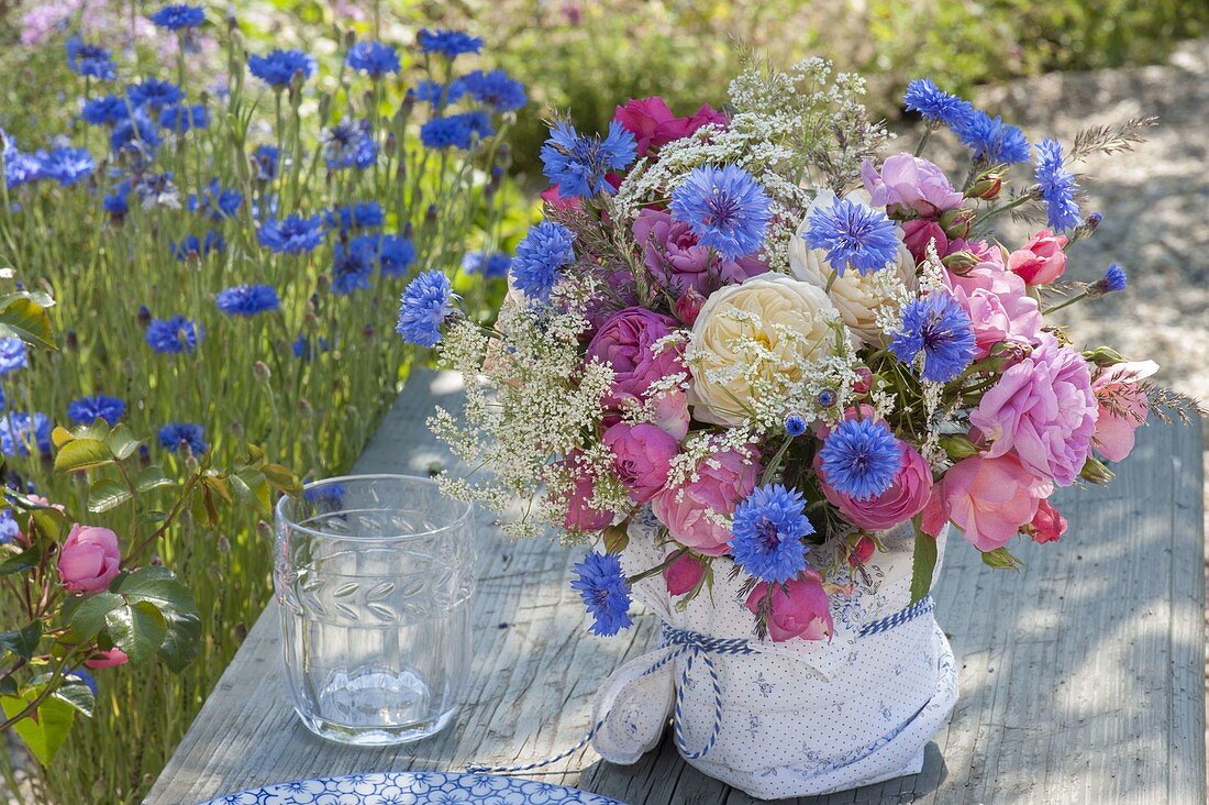 Fragrant bouquet of Centaurea cyanus (cornflowers), Rosa (roses)