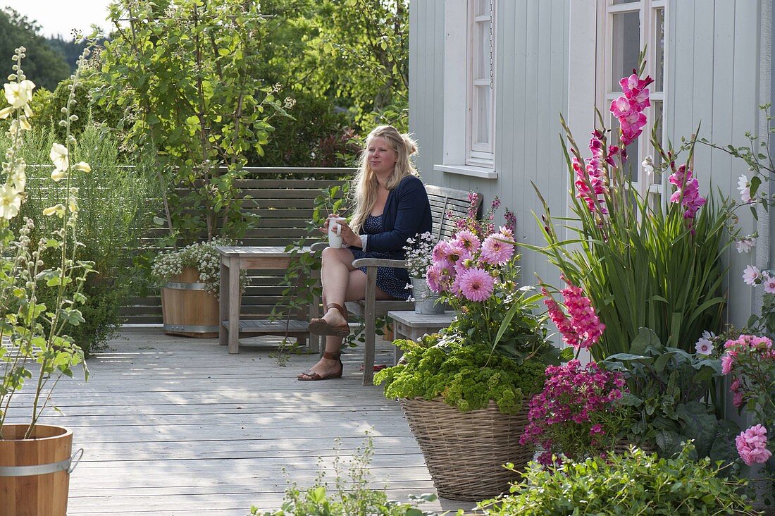 Balcony with flowers, herbs, berry fruits and vegetables