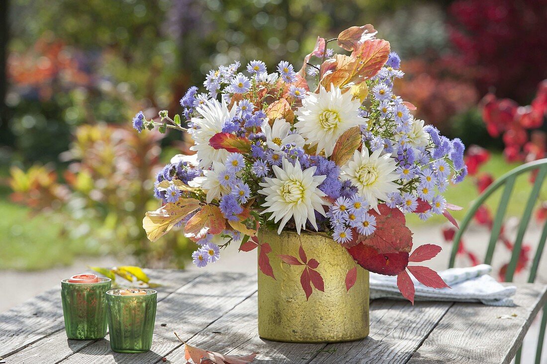 Autumnal bouquet of aster, dahlia and twigs