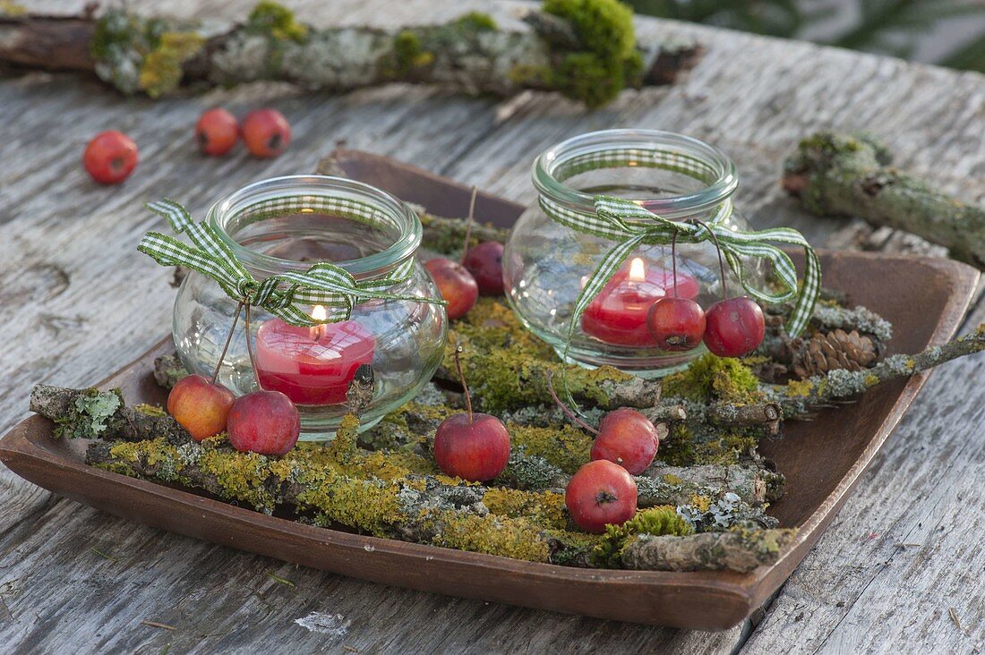 Preserving jars as lanterns, decorated with Malus (ornamental apple)
