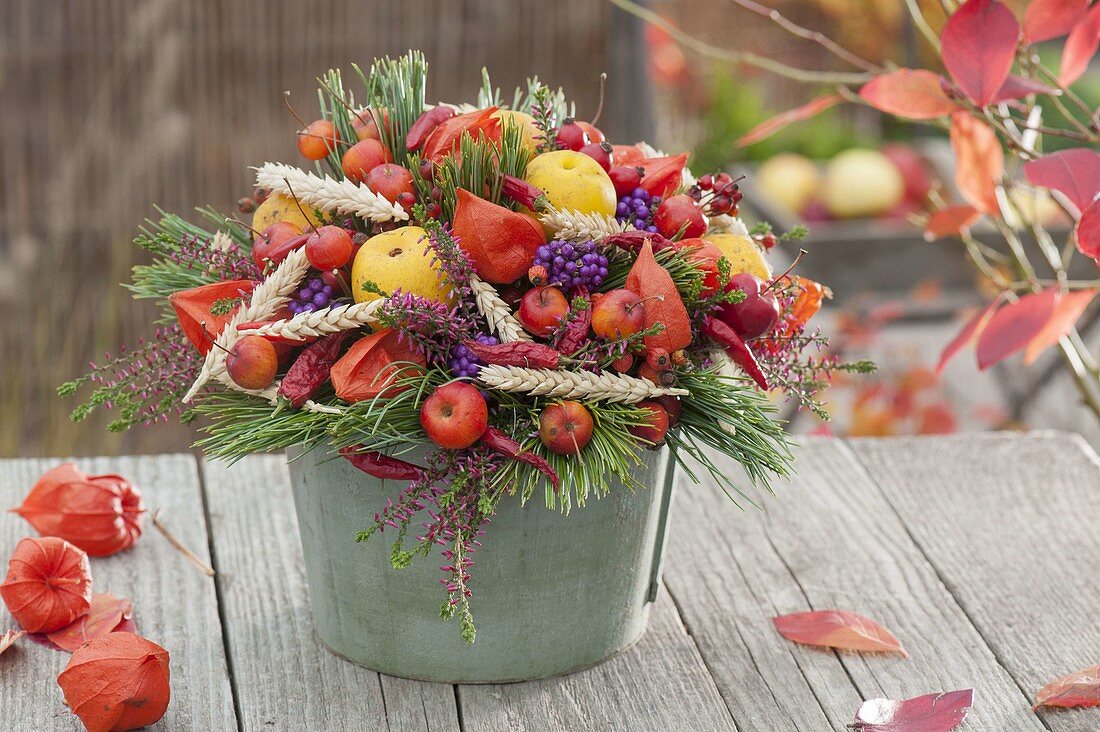 Autumn bouquet with fruits, berries and ears of wheat