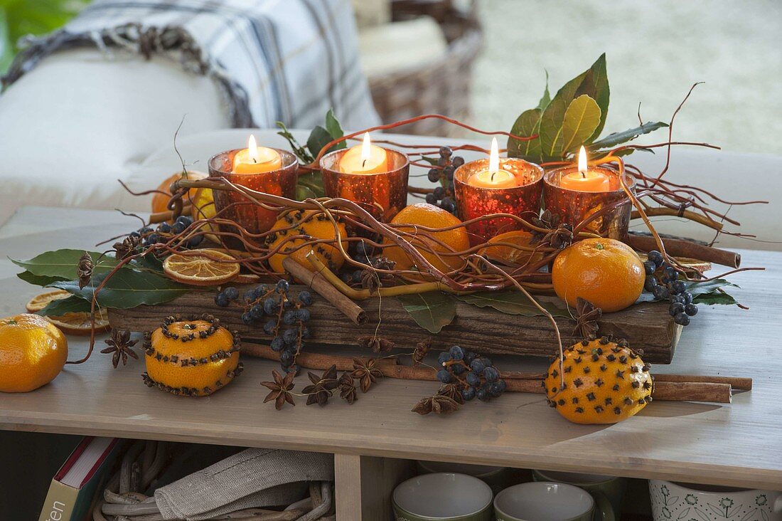 Mediterranean Christmas arrangement with tangerines some of them with carnations