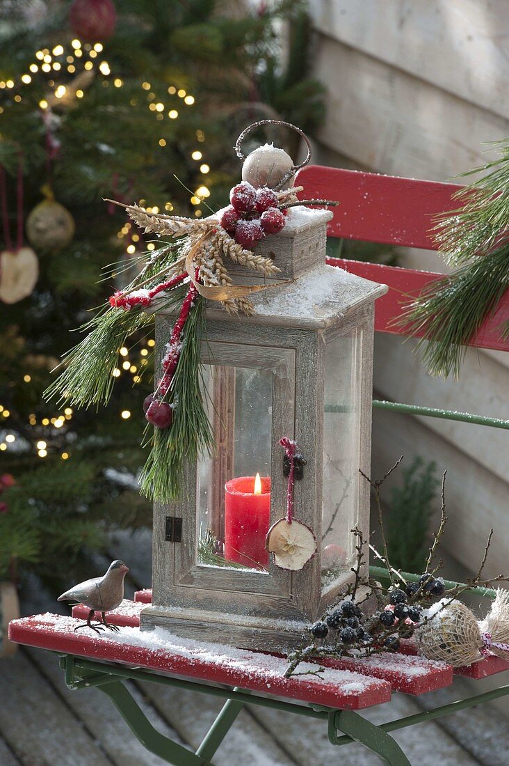 Lantern decorated with crop ears, ornamental apples, pinus