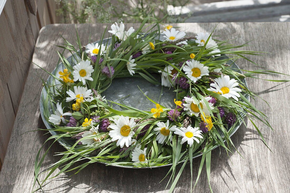 Wreath made of meadow flower , grasses, leucanthemum (marguerite)